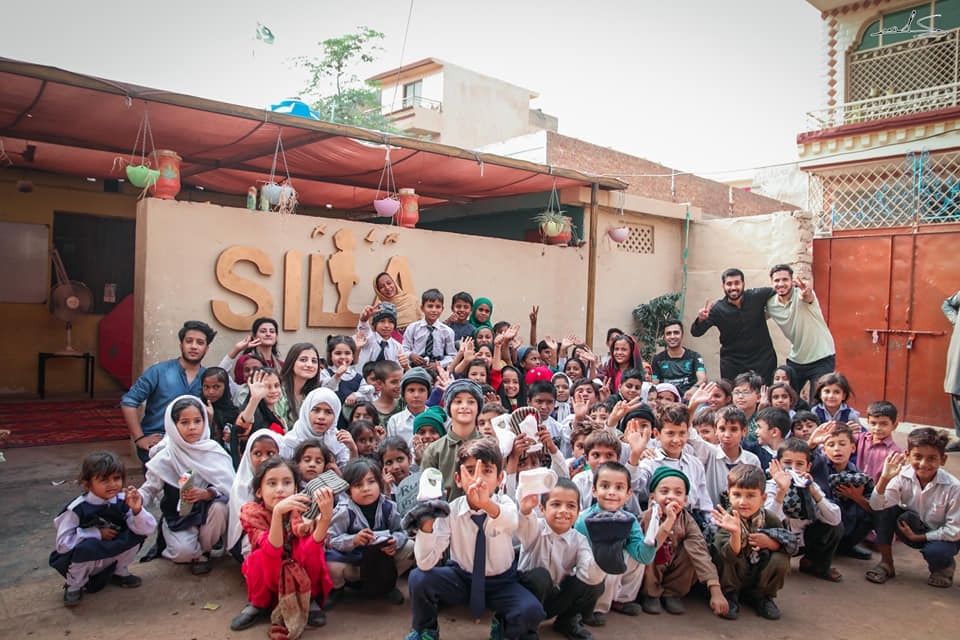 SILA School students studying outdoors